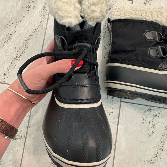 Sorel Kids’ Yoot Pac Waterproof Snow Boot Black and Faux-Shearling - Picture 4 of 9